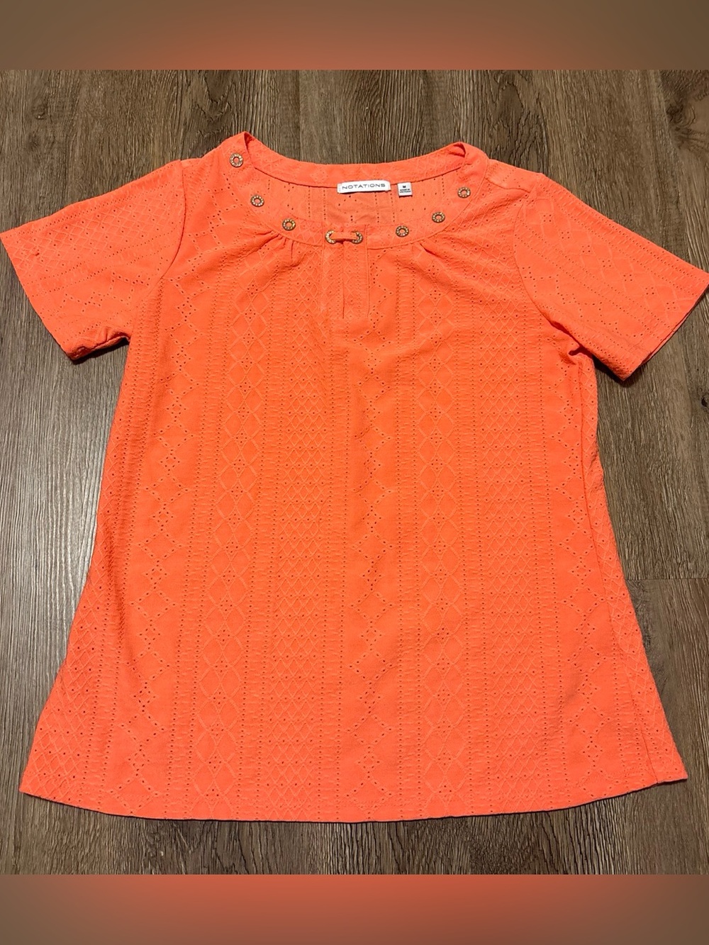 women’s orange blouse